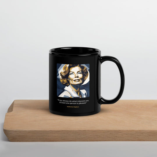 Black Glossy Mug: "If you always do what interests you, at least one person is pleased." (Hepburn) - LeadershipQuotes.com